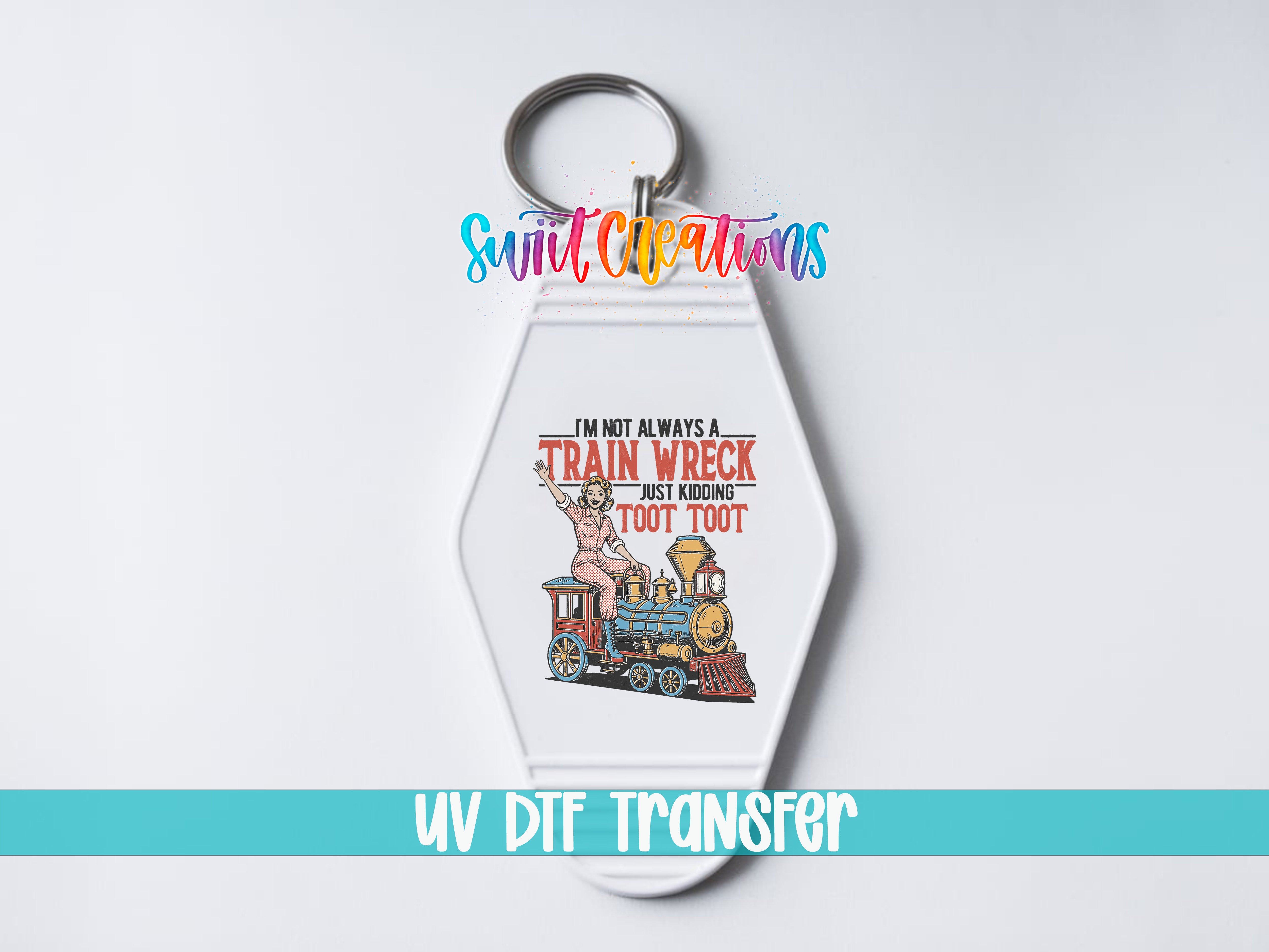 A keychain with a colorful train wreck graphic and text that says "I'm not always a train wreck, but sometimes I'm just too loud".