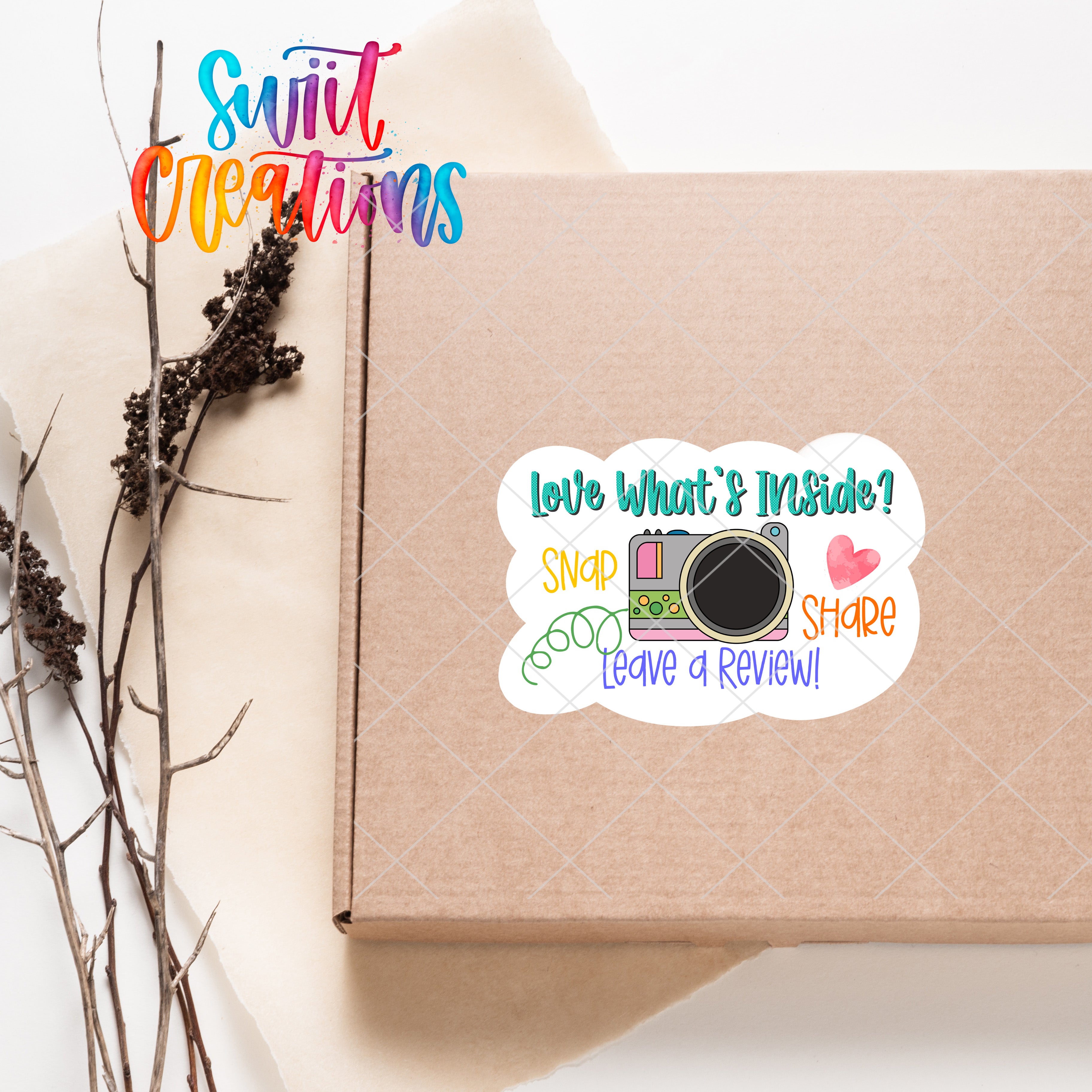 a box with a sticker on it next to a plant
