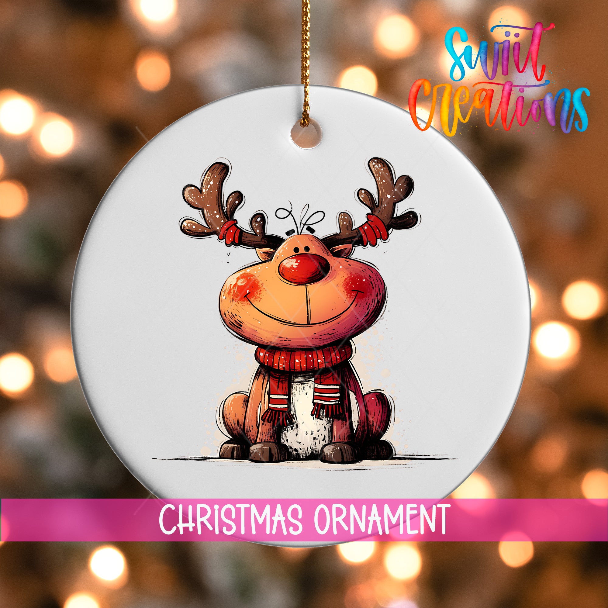 A white Christmas ornament featuring a smiling reindeer with antlers, set against a blurred background with colorful lights.