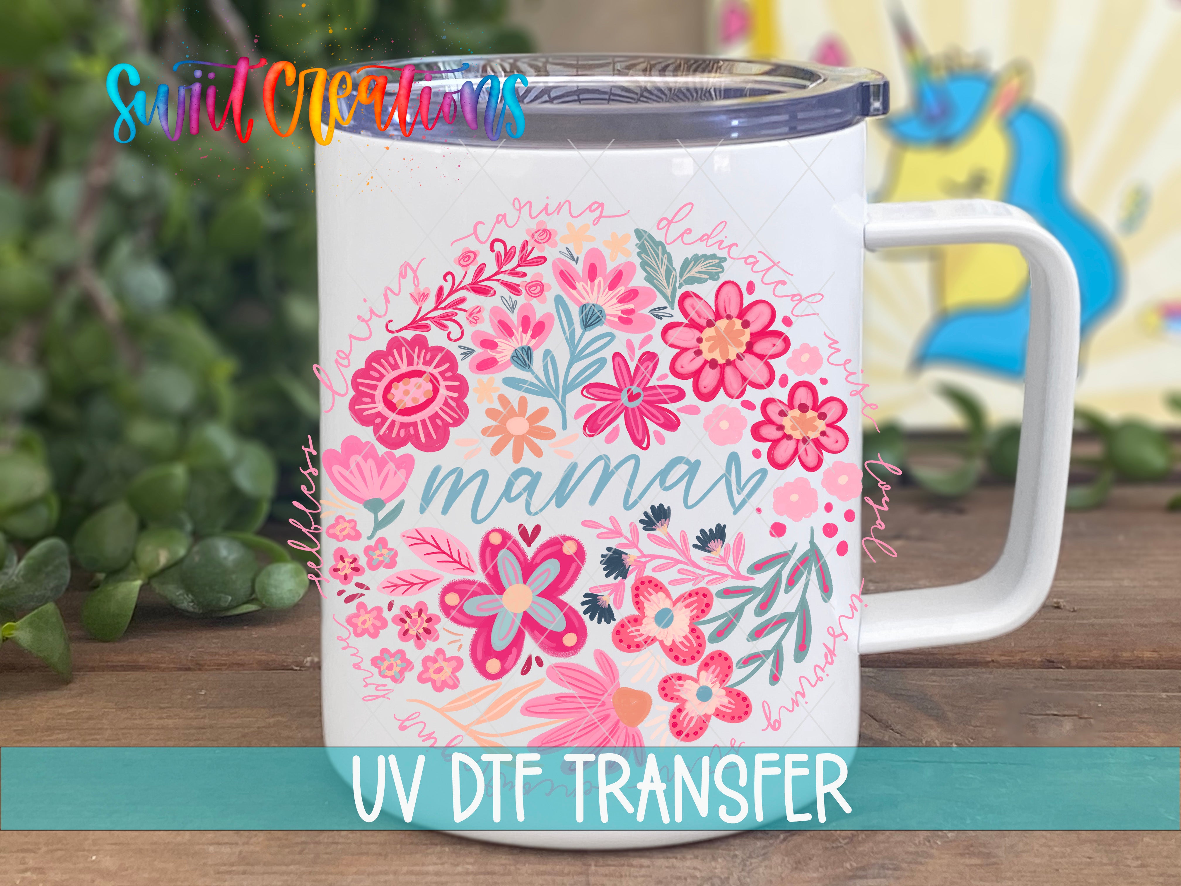 A white ceramic mug with a floral design and the word "mama" printed on it, placed on a wooden surface.