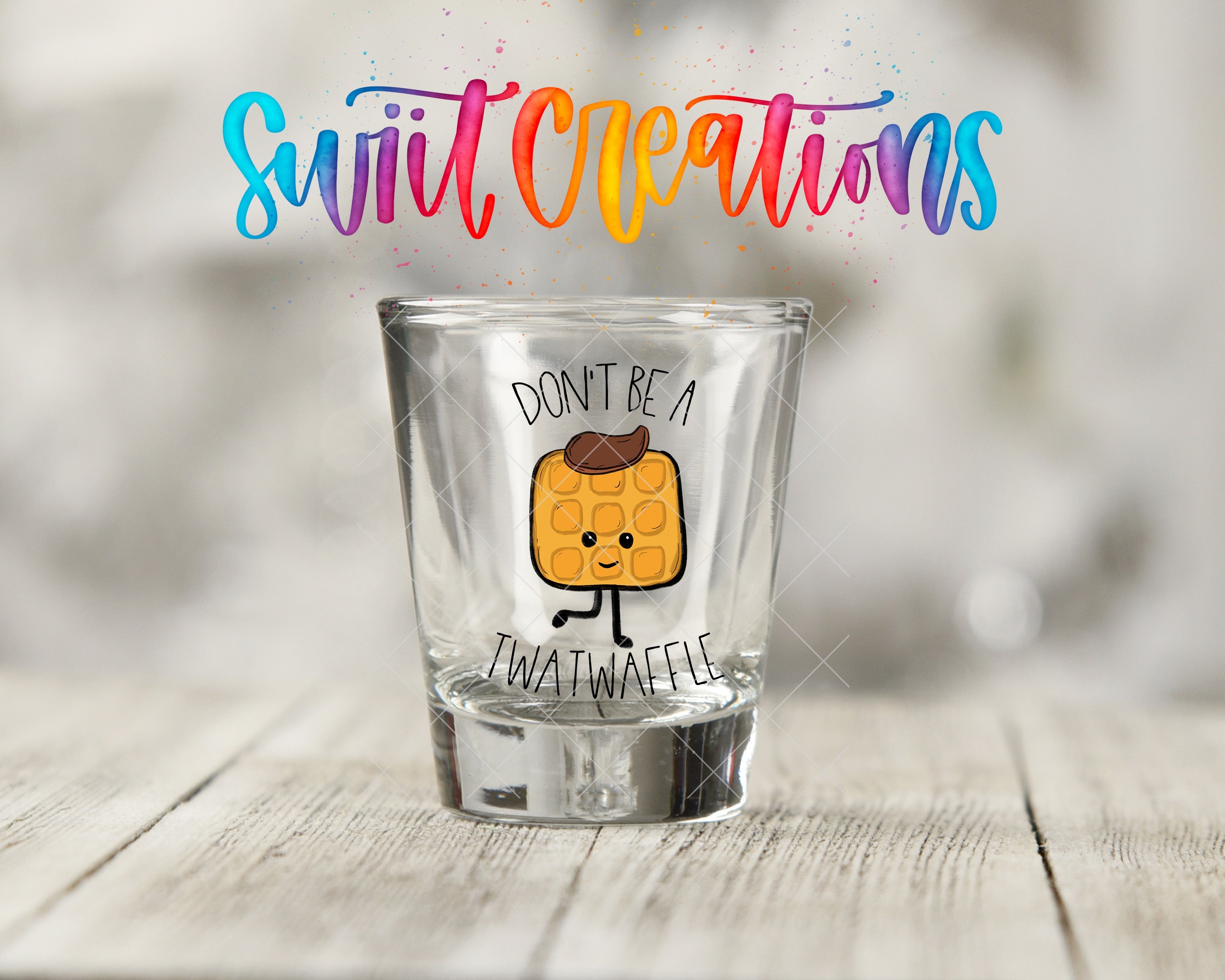 a shot glass with a sticker on it that says, don't be