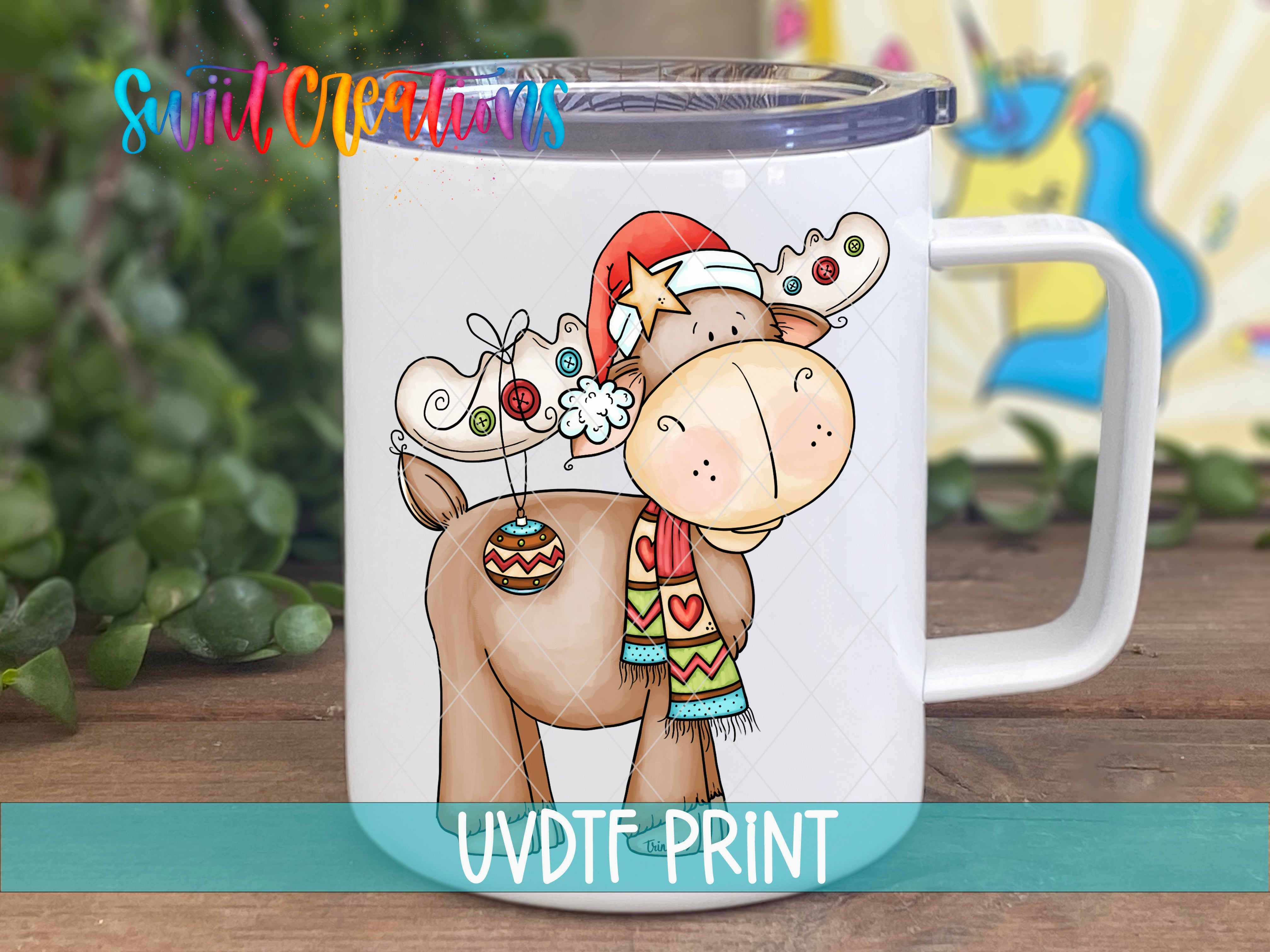 a coffee mug with a picture of a moose wearing a santa hat