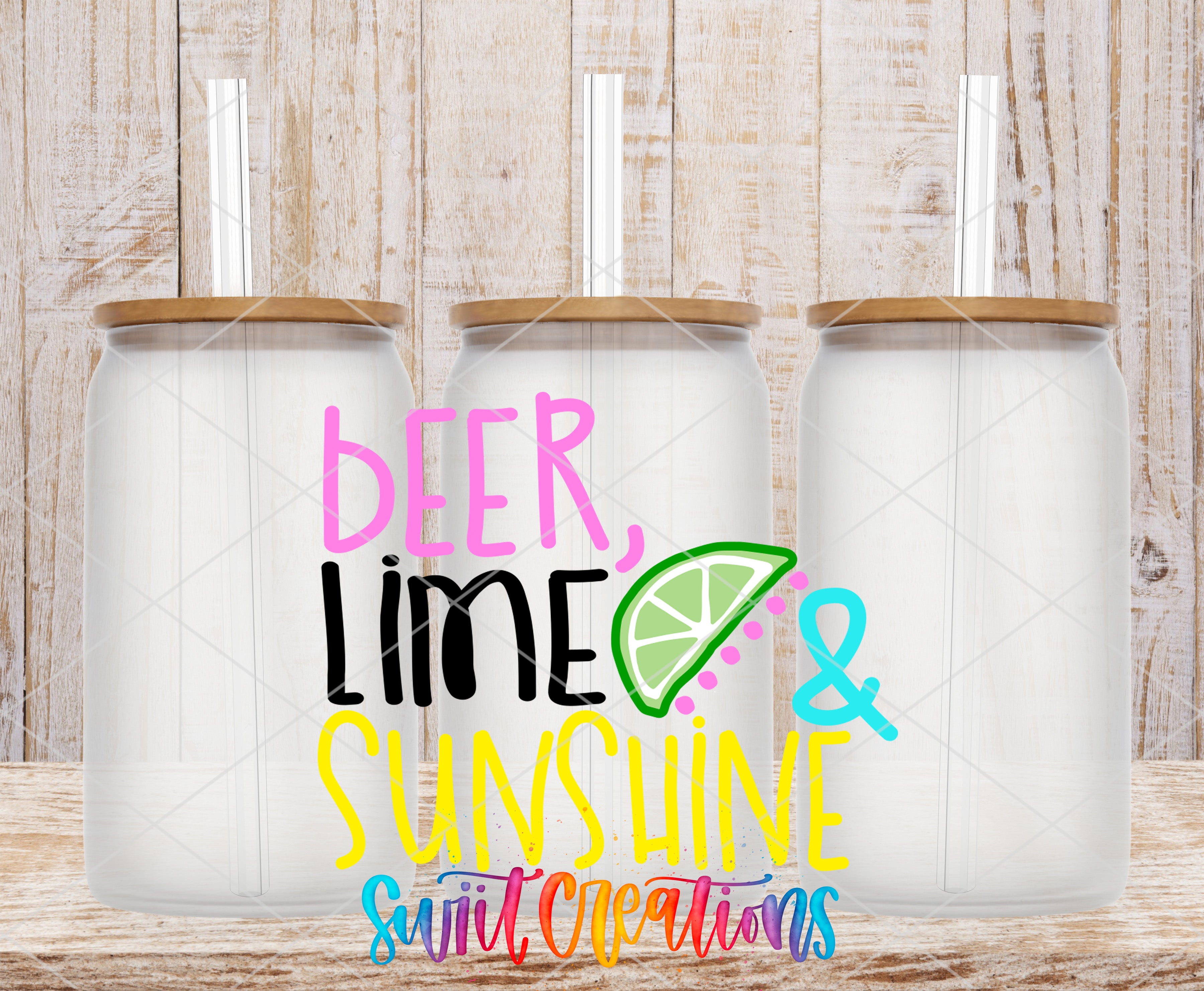 Three glass tumblers with straws, each with a lid, arranged in a row against a wooden background.