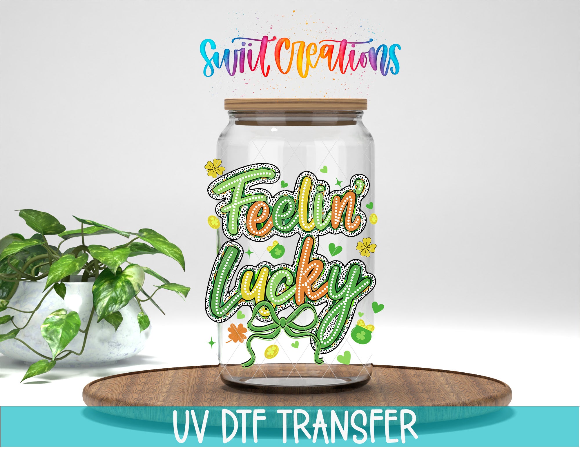 a glass jar with a colorful, hand-drawn design on it, placed on a wooden surface. The jar has a lid and is surrounded by various decorative elements, such as flowers and leaves. The text "Feelin' Lucky" is prominently displayed on the jar, and the phrase "UV DFT TRANSFER" is written below the jar.