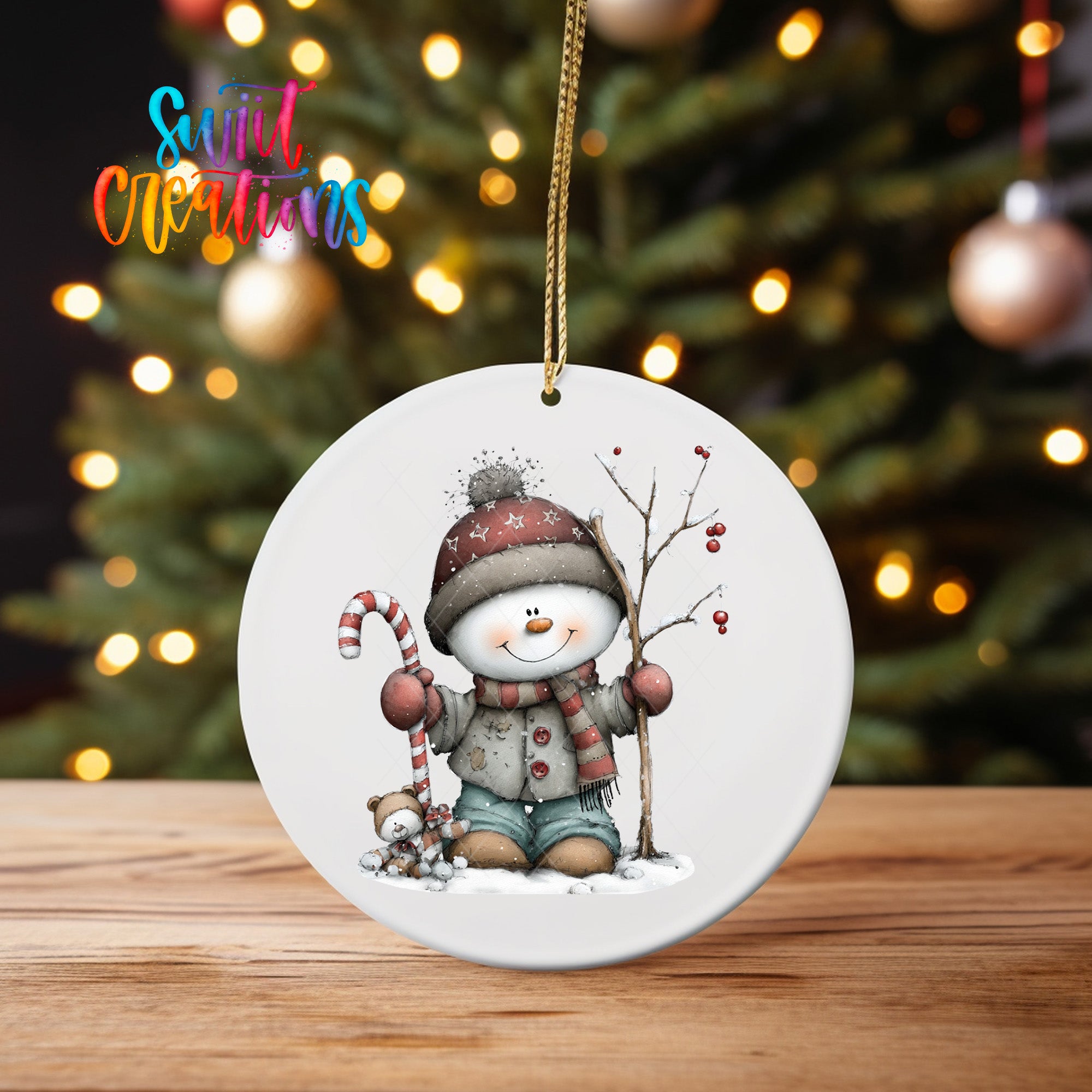A white ornament featuring a snowman and a candy cane, with a Christmas tree in the background.