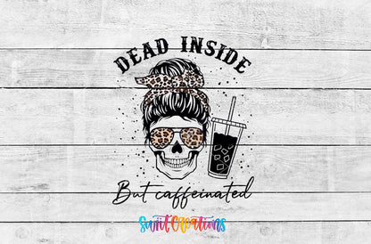 Dead Inside But Caffeinated messy bun skull with iced coffee UV DTF transfer artwork on a white wood background