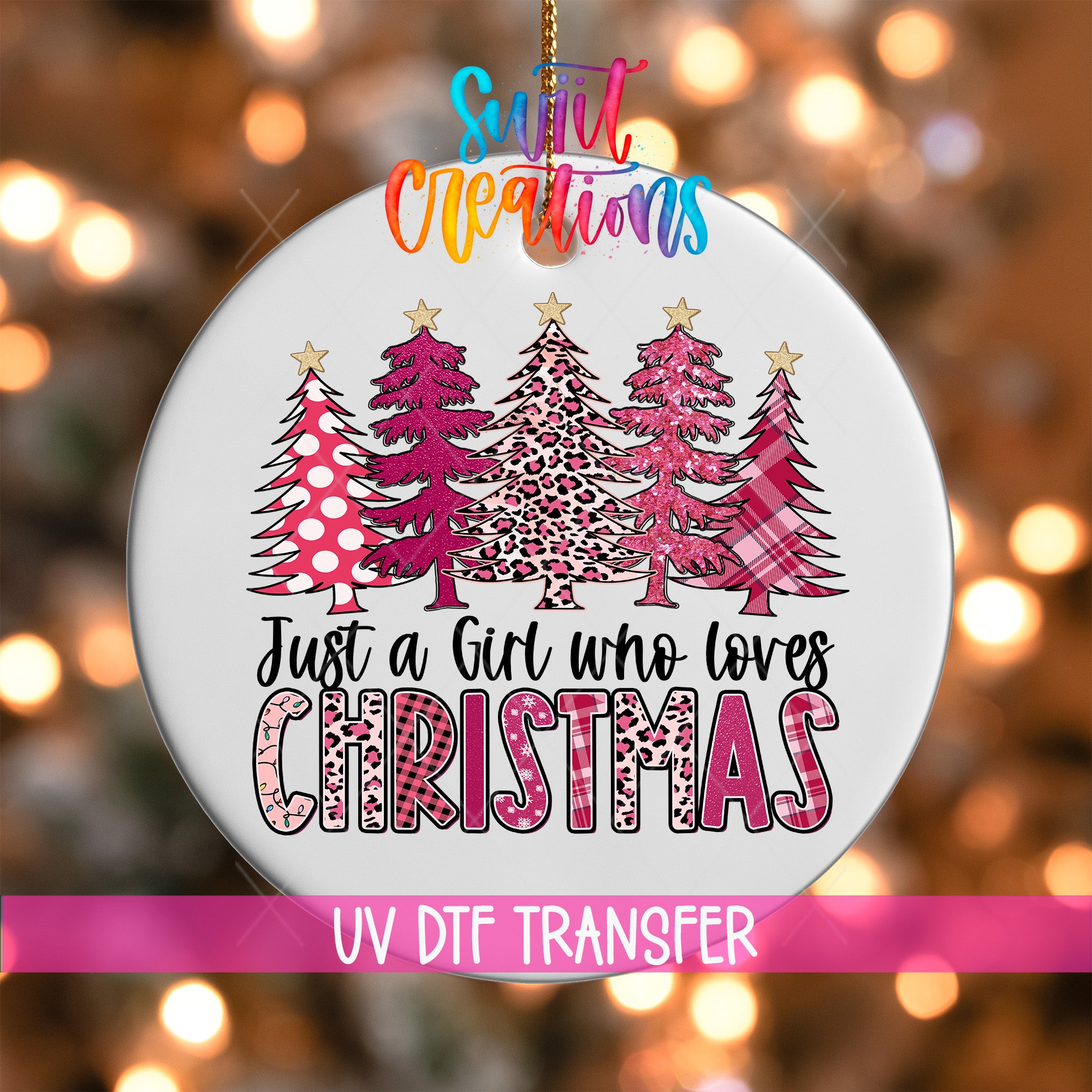 A Christmas ornament with a design of pink and leopard print trees, along with the text "Just a Girl who loves Christmas".