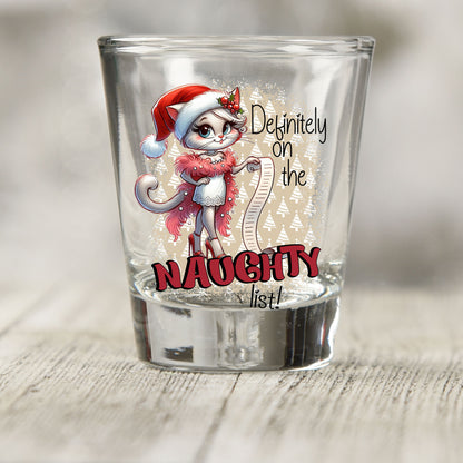 Definitely on the Naughty List Christmas shot glass UV DTF transfer with cat in a Santa hat and pink boa on a clear shot glass