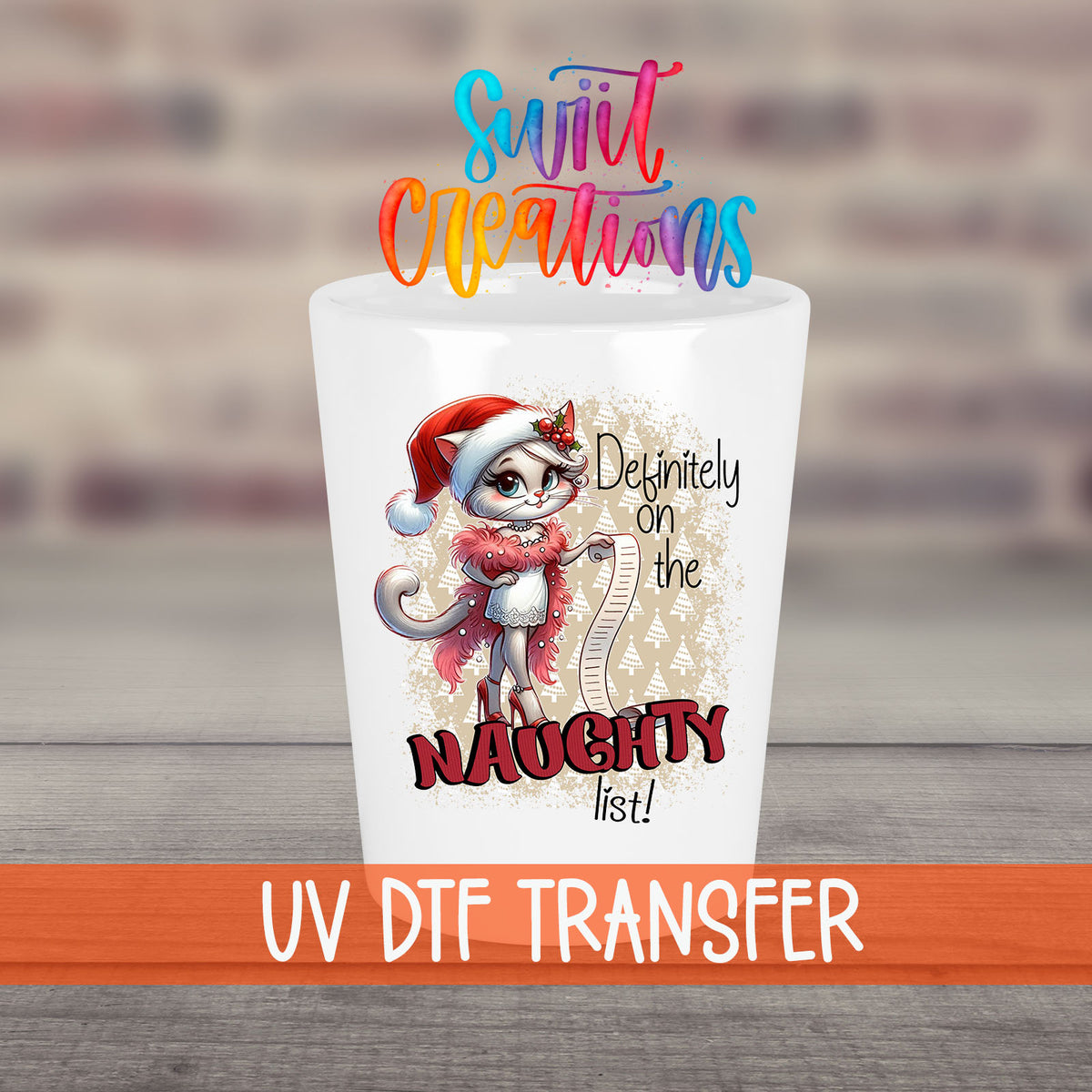 Definitely on the Naughty List Christmas UV DTF transfer on a white shot glass in front of a brick wall
