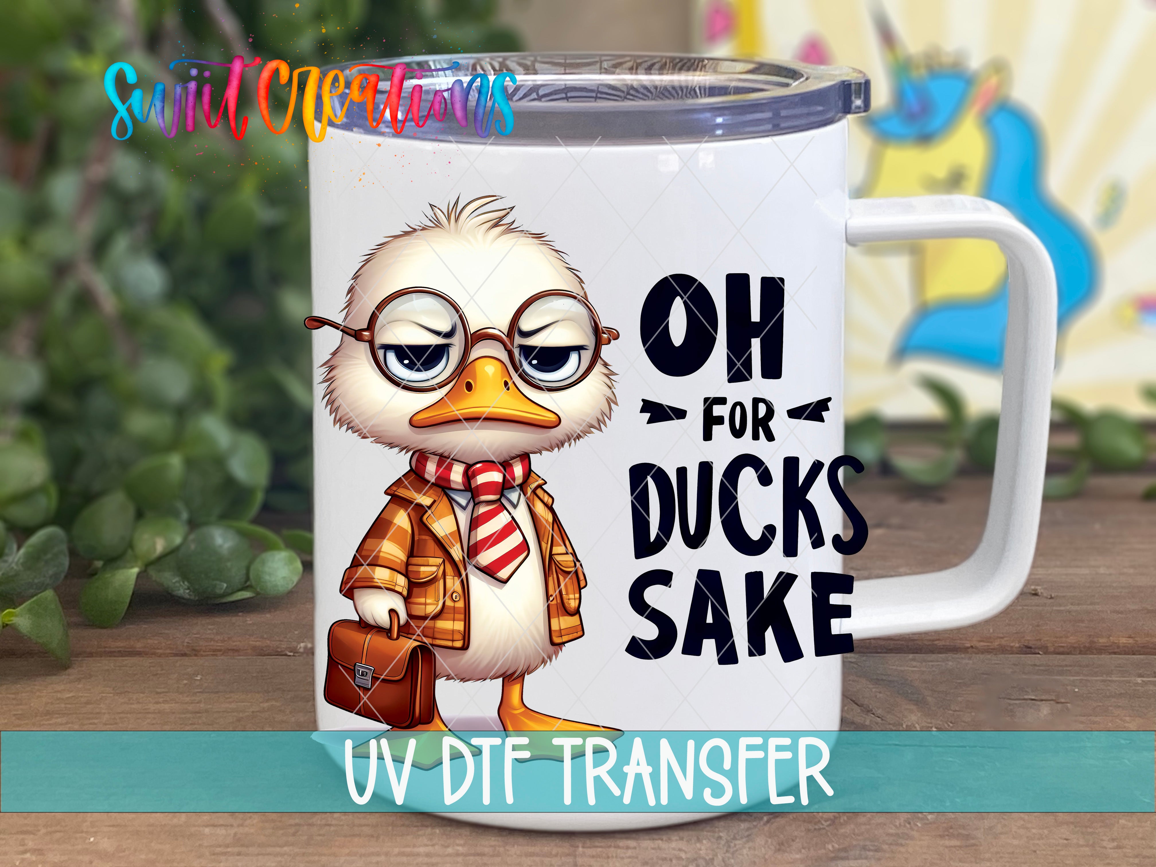 A mug with a cartoon duck wearing glasses and a scarf, along with the text "OH FOR DUCKS SAKE" printed on it.