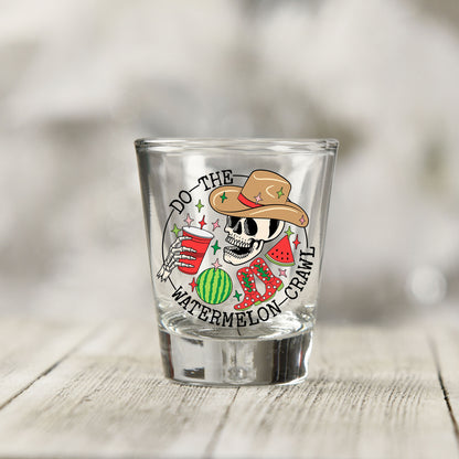 Close-up of the Do The Watermelon Crawl UV DTF transfer on a clear shot glass