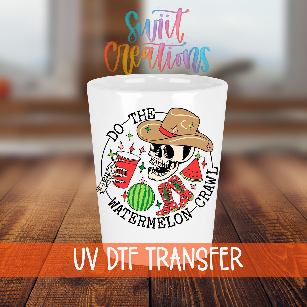 Do The Watermelon Crawl shot glass transfer on a white shot glass on a wooden table
