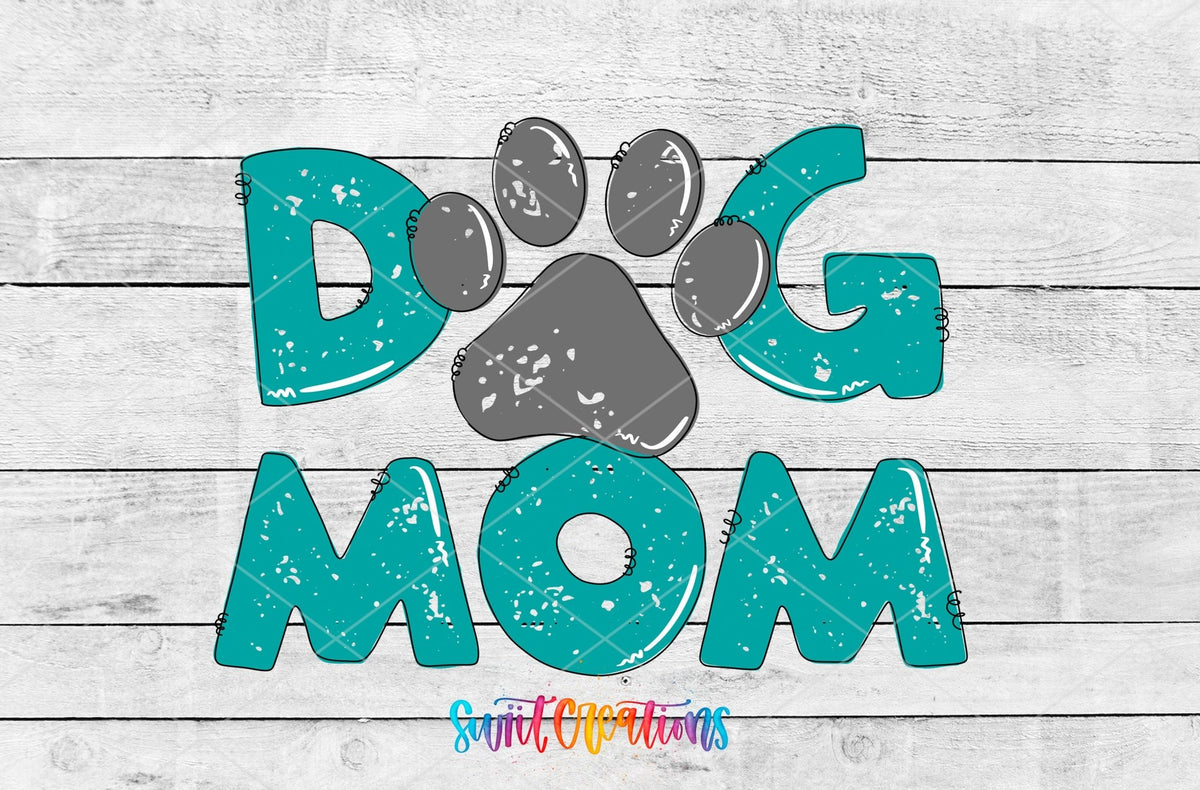 Dog Mom teal letters and paw print UV DTF transfer artwork on a white wood background