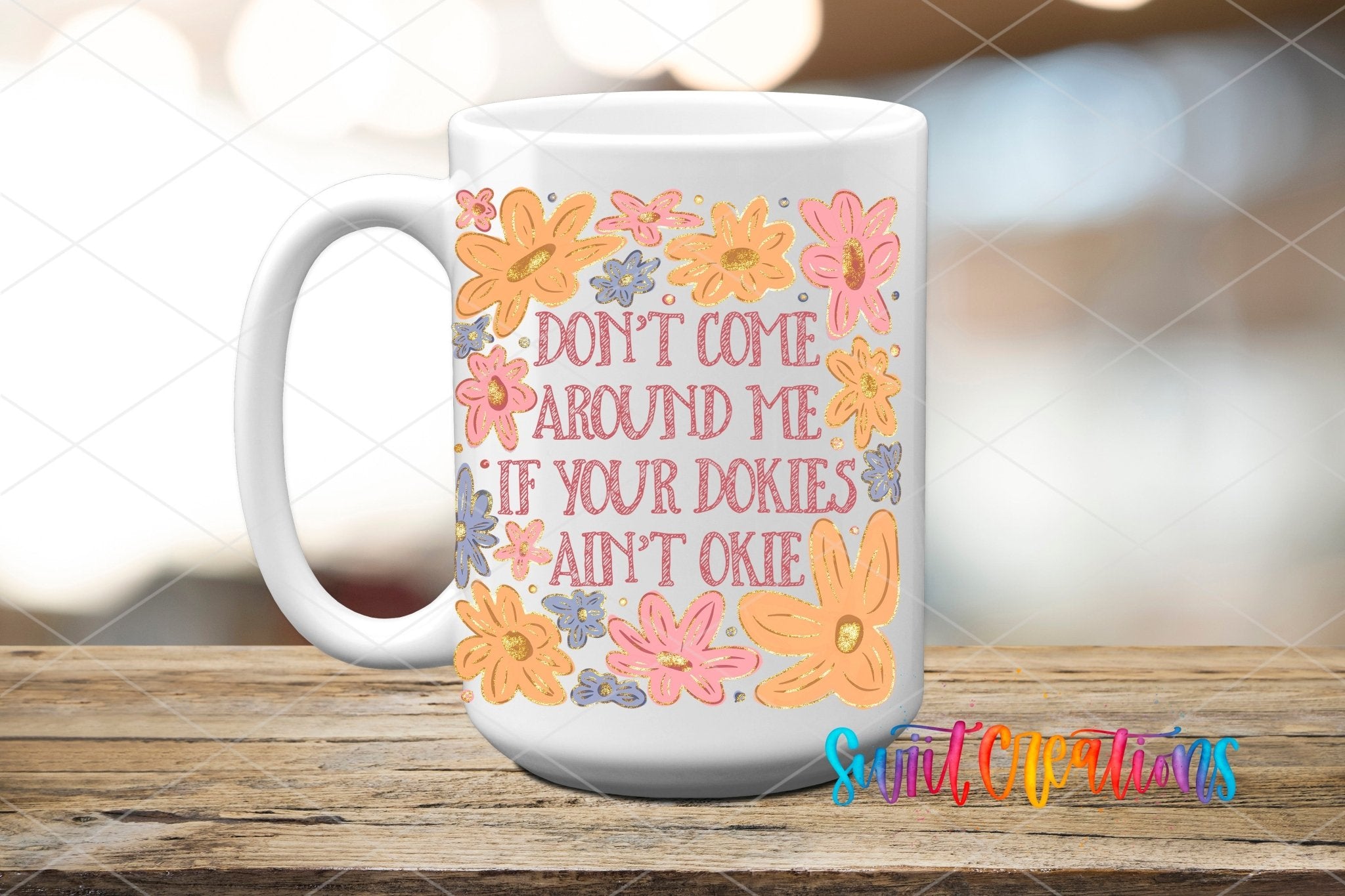 Dokies Ain’t Okie UV DTF transfer displayed on a white ceramic mug from Swiit Creations