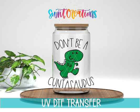 Swiit Creations Don’t Be a Cuntasaurus UV DTF transfer mockup on a glass jar with a funny green dinosaur design.