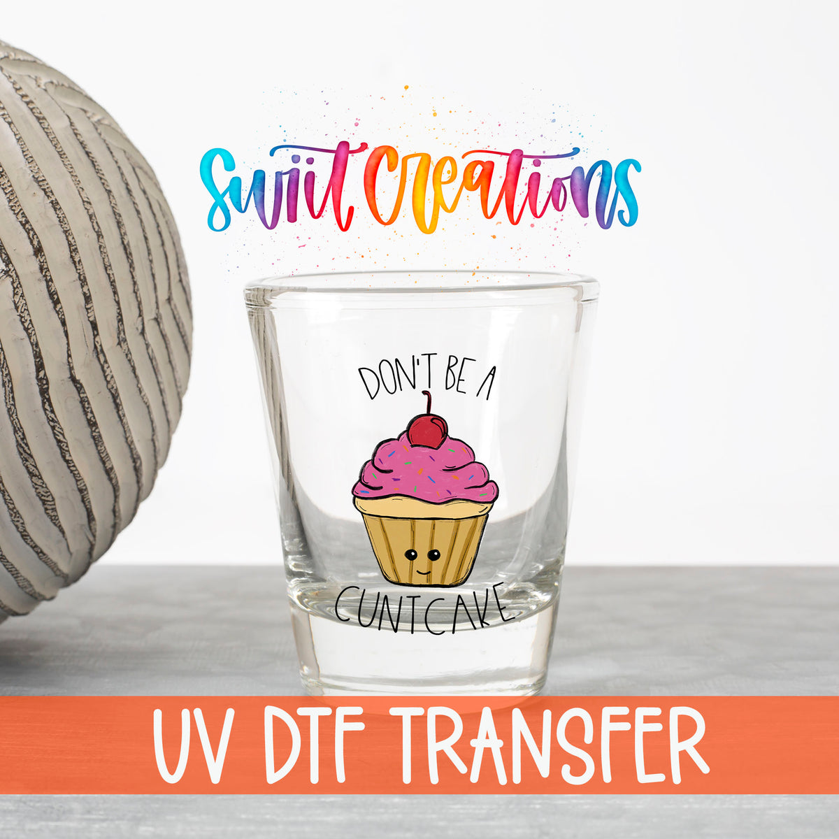 Don't Be a Cuntcake UV DTF transfer on a clear shot glass with the Swiit Creations logo and UV DTF Transfer banner