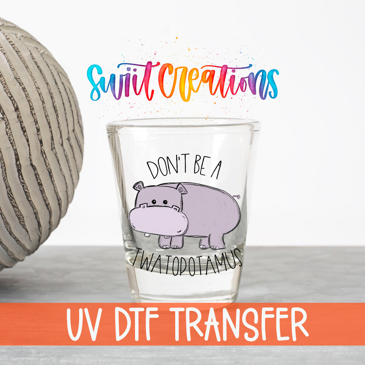 Don't Be a Twatopotamus UV DTF transfer on a clear shot glass with the Swiit Creations logo and UV DTF Transfer banner