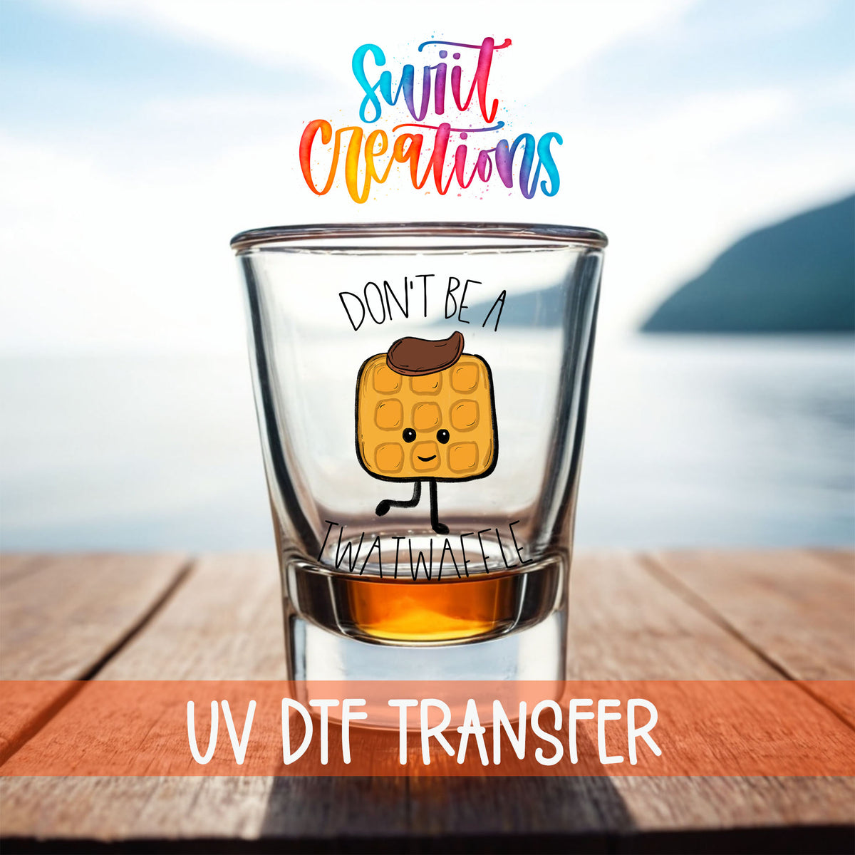 Don't Be a Twatwaffle shot glass UV DTF transfer on a filled shot glass on a dock by the water