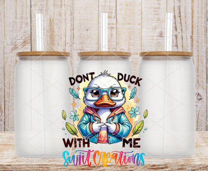 Don't Duck With Me duck in a blue jacket UV DTF transfer on frosted glass cans with bamboo lids