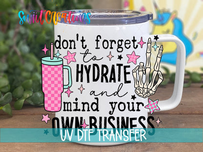 Hydrate and Mind Your Own Business UV DTF transfer on a white stainless steel mug with a lid