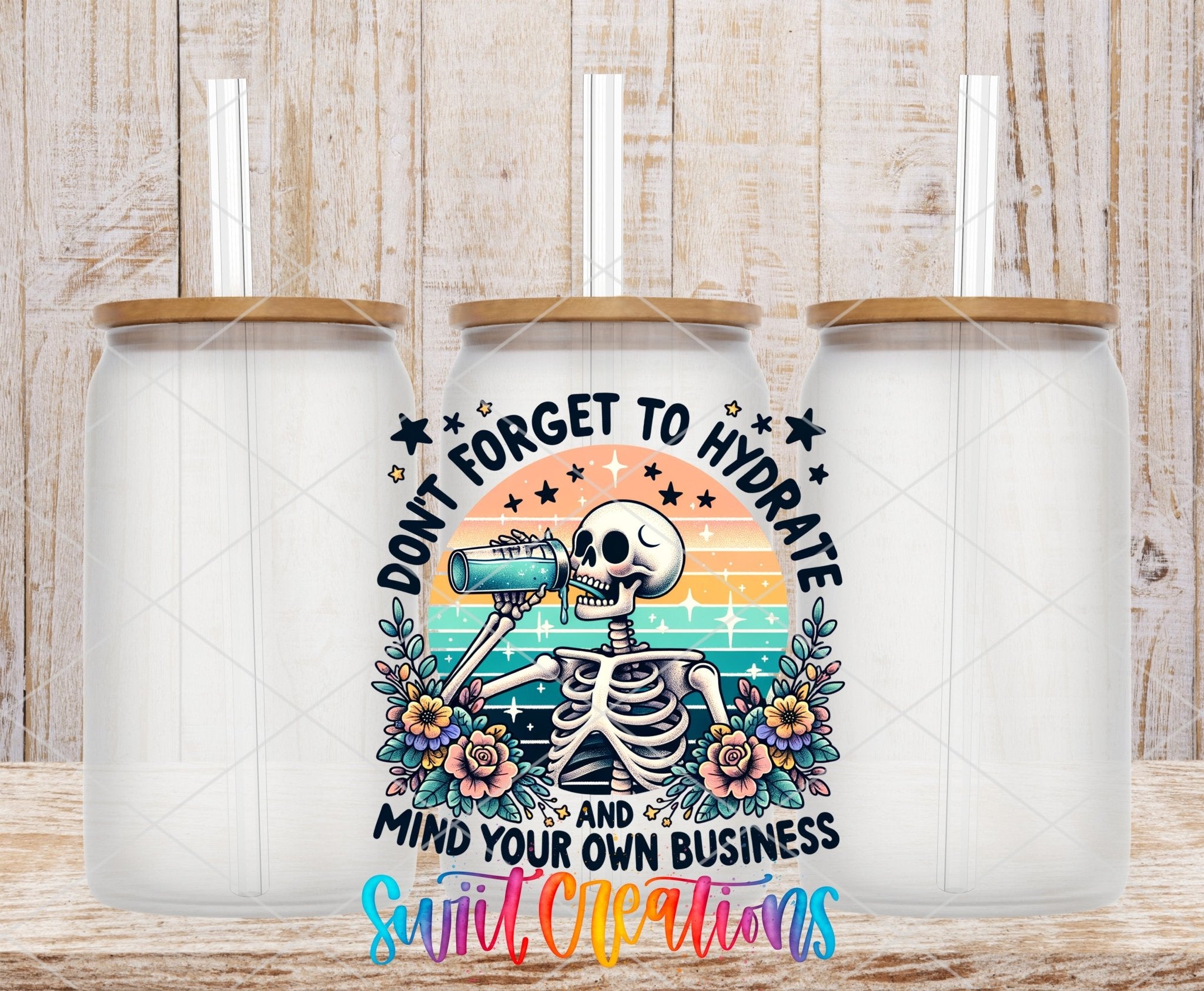 Don’t Forget to Hydrate UV DTF transfer applied to a clear glass can set from Swiit Creations