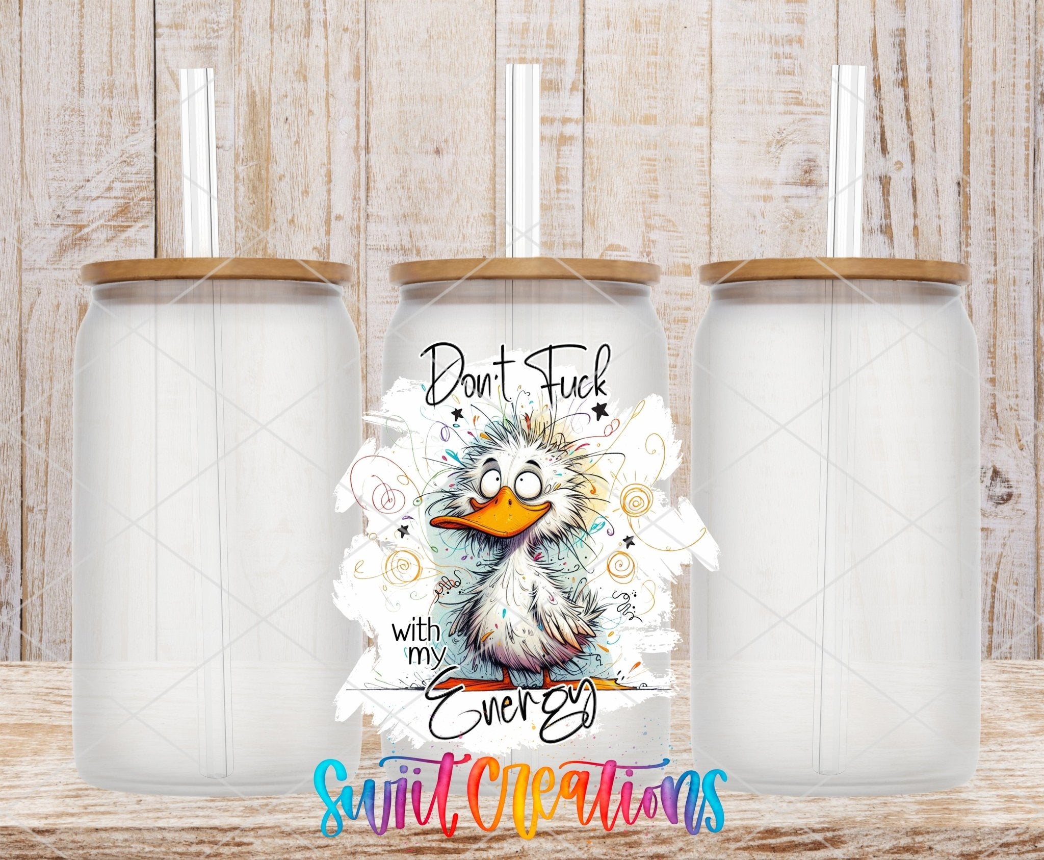 Swiit Creations UV DTF Don’t Fuck With My Energy transfer shown on a clear glass can set