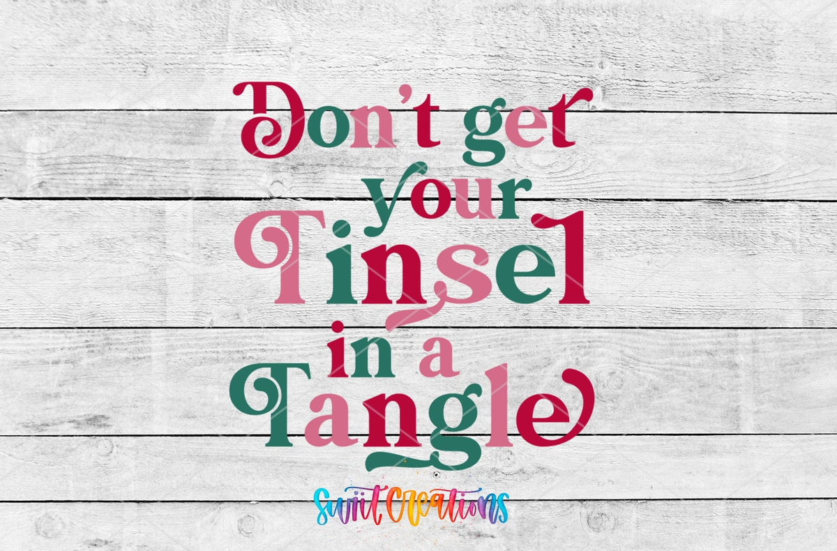 Don't Get Your Tinsel in a Tangle UV DTF transfer artwork on a white wood background