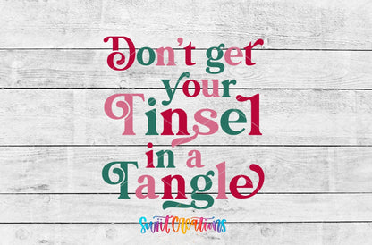Don't Get Your Tinsel in a Tangle UV DTF transfer artwork on a white wood background