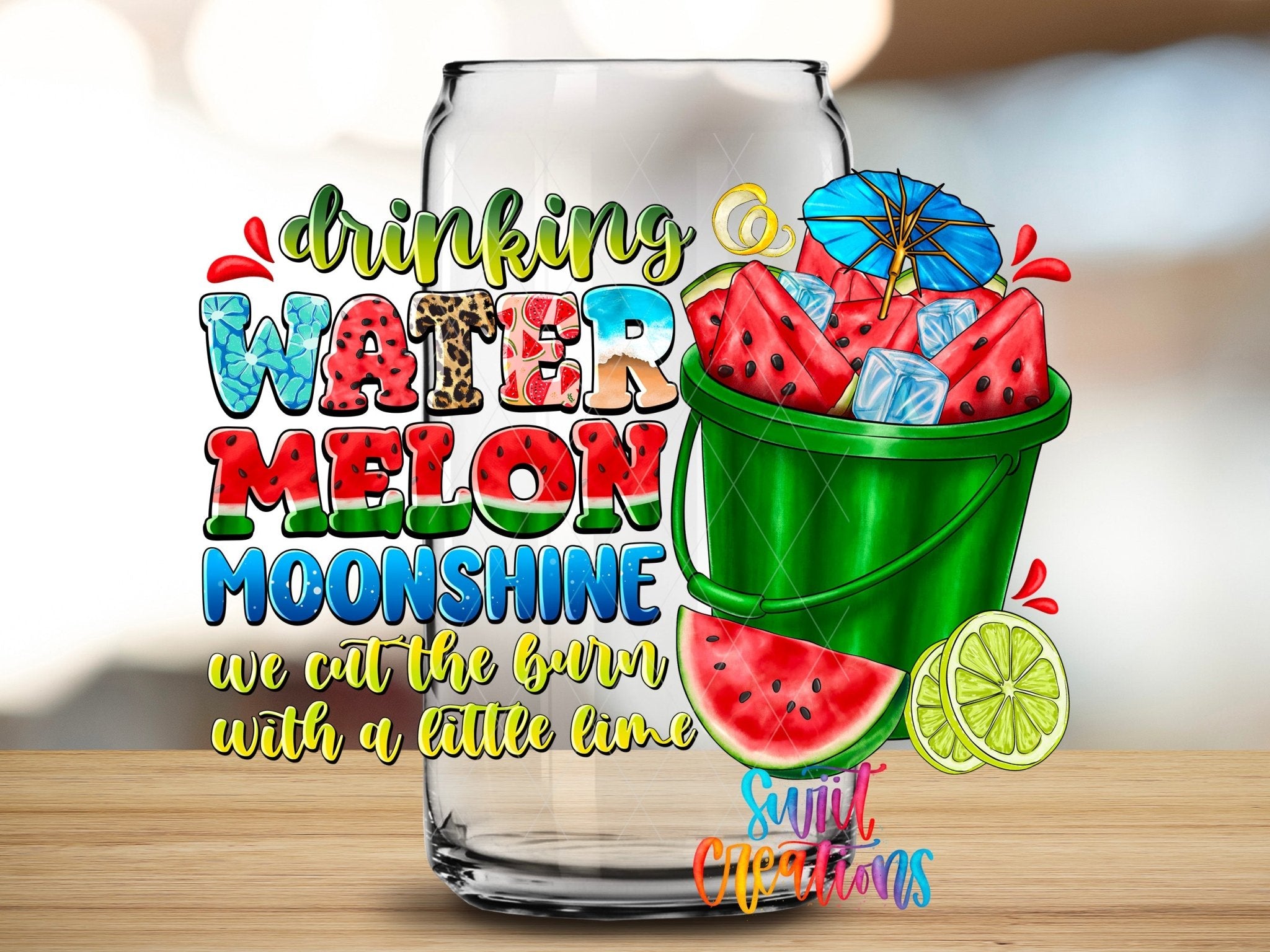 Drinking Watermelon Moonshine UV DTF transfer applied to a clear glass can from Swiit Creations