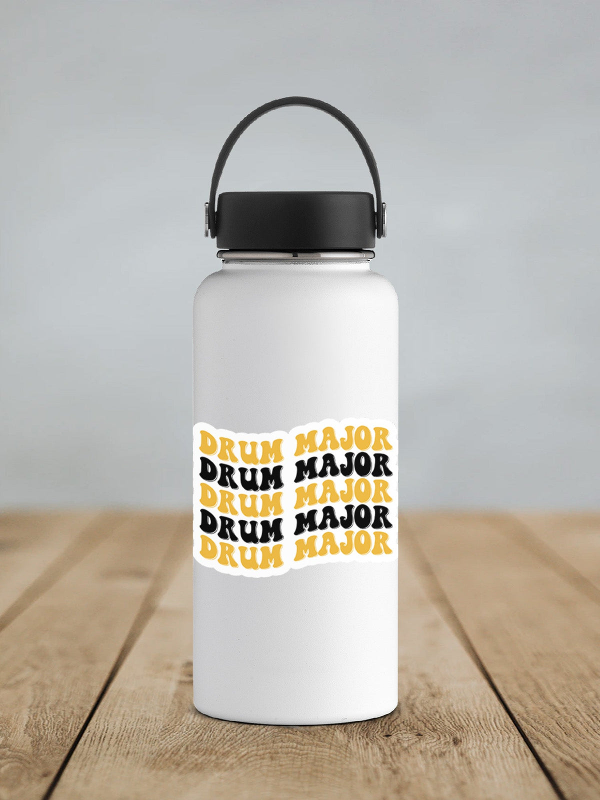 Black and Gold Drum Major sticker on a white insulated water bottle