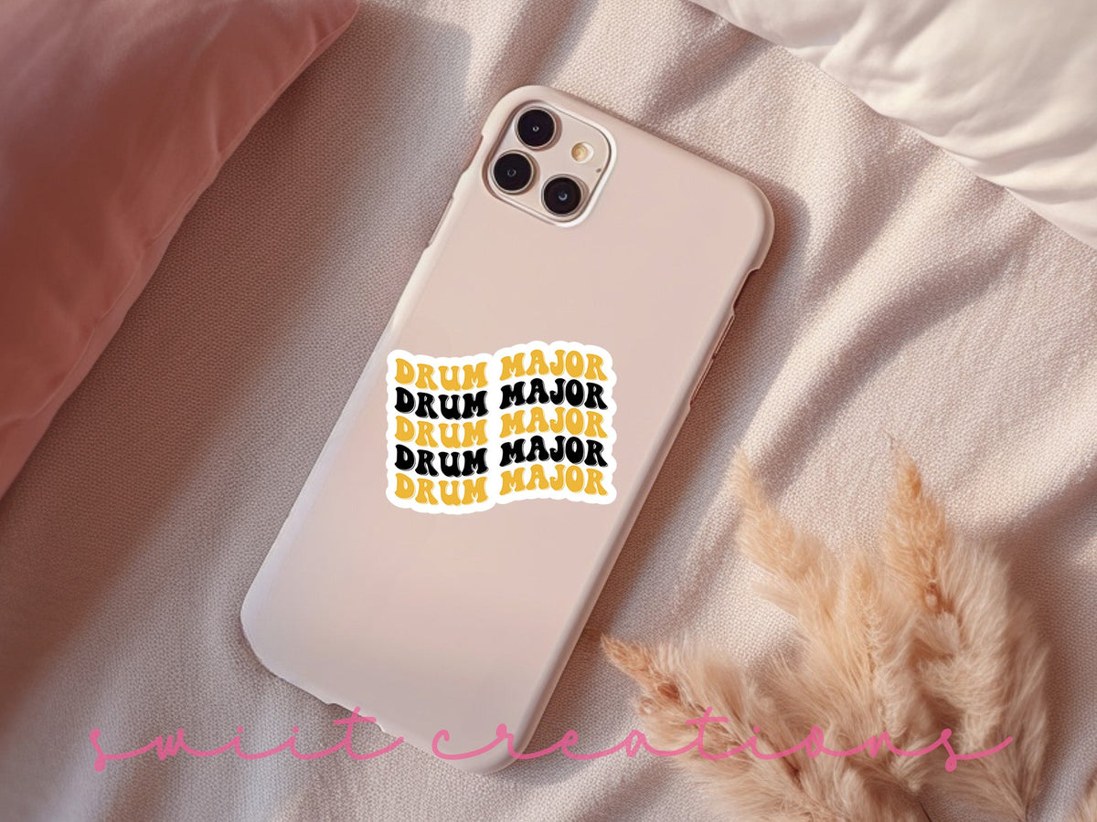 Black and Gold Drum Major sticker on a pink phone case