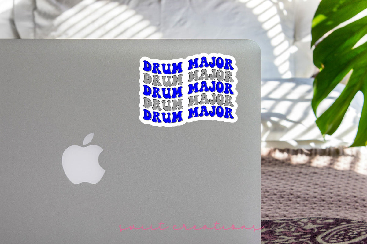 Blue and Silver Drum Major sticker on the lid of a silver laptop