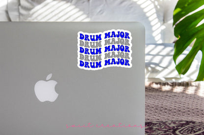 Blue and Silver Drum Major sticker on the lid of a silver laptop