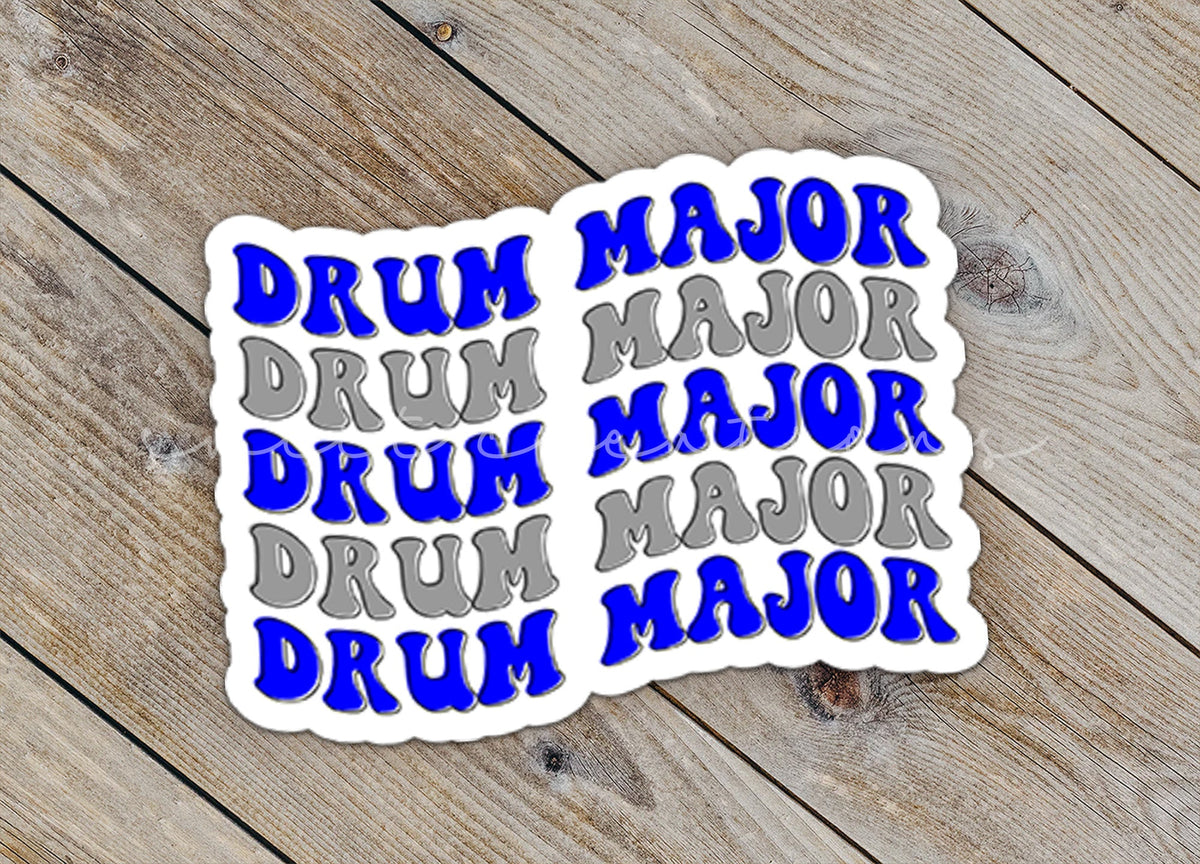 Close-up of the Blue and Silver Drum Major sticker on rustic wood