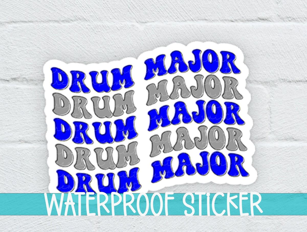 Blue and Silver Drum Major sticker on a white brick background with a waterproof sticker banner
