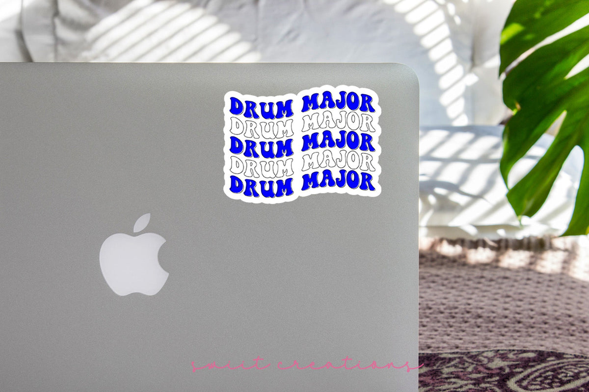 Blue and White Drum Major sticker on the lid of a silver laptop