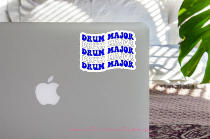 Blue and White Drum Major sticker on the lid of a silver laptop