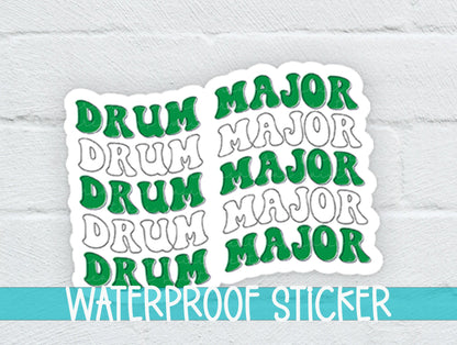 Green and White Drum Major sticker on a white brick background with a waterproof sticker banner
