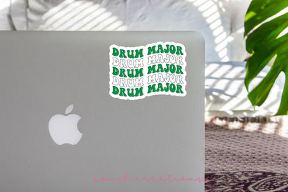 Green and White Drum Major sticker on the lid of a silver laptop
