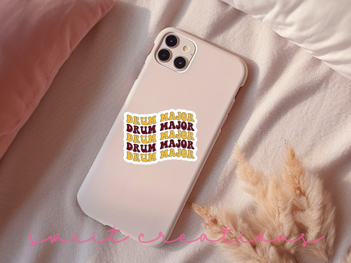 Maroon and Gold Drum Major sticker on a pink phone case