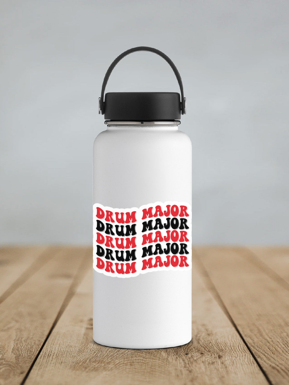 Red and Black Drum Major sticker on a white insulated water bottle