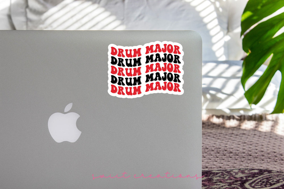 Red and Black Drum Major sticker on the lid of a silver laptop