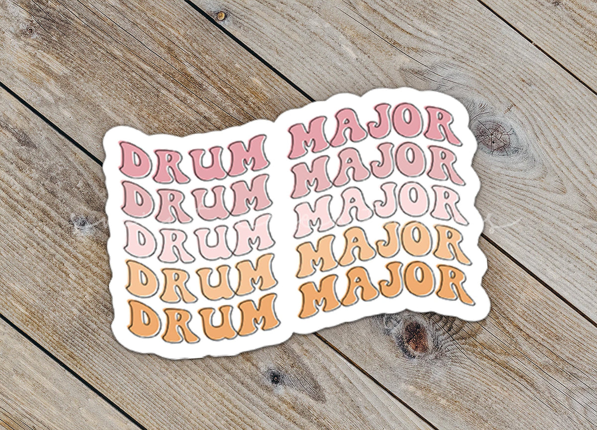 Close-up of the Retro Drum Major sticker on rustic wood