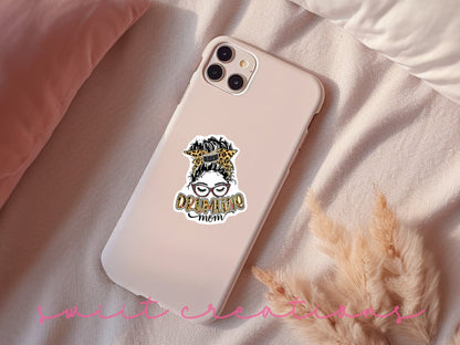 Drumline Mom sticker on a pink phone case