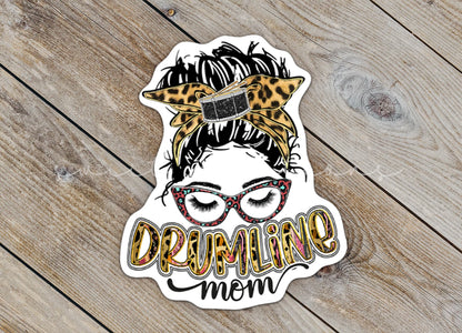 Close-up of the Drumline Mom sticker on rustic wood