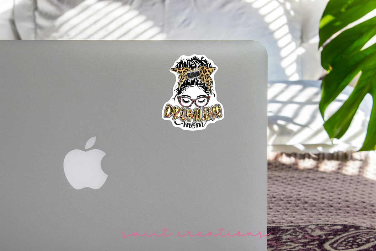 Drumline Mom sticker on the lid of a silver laptop