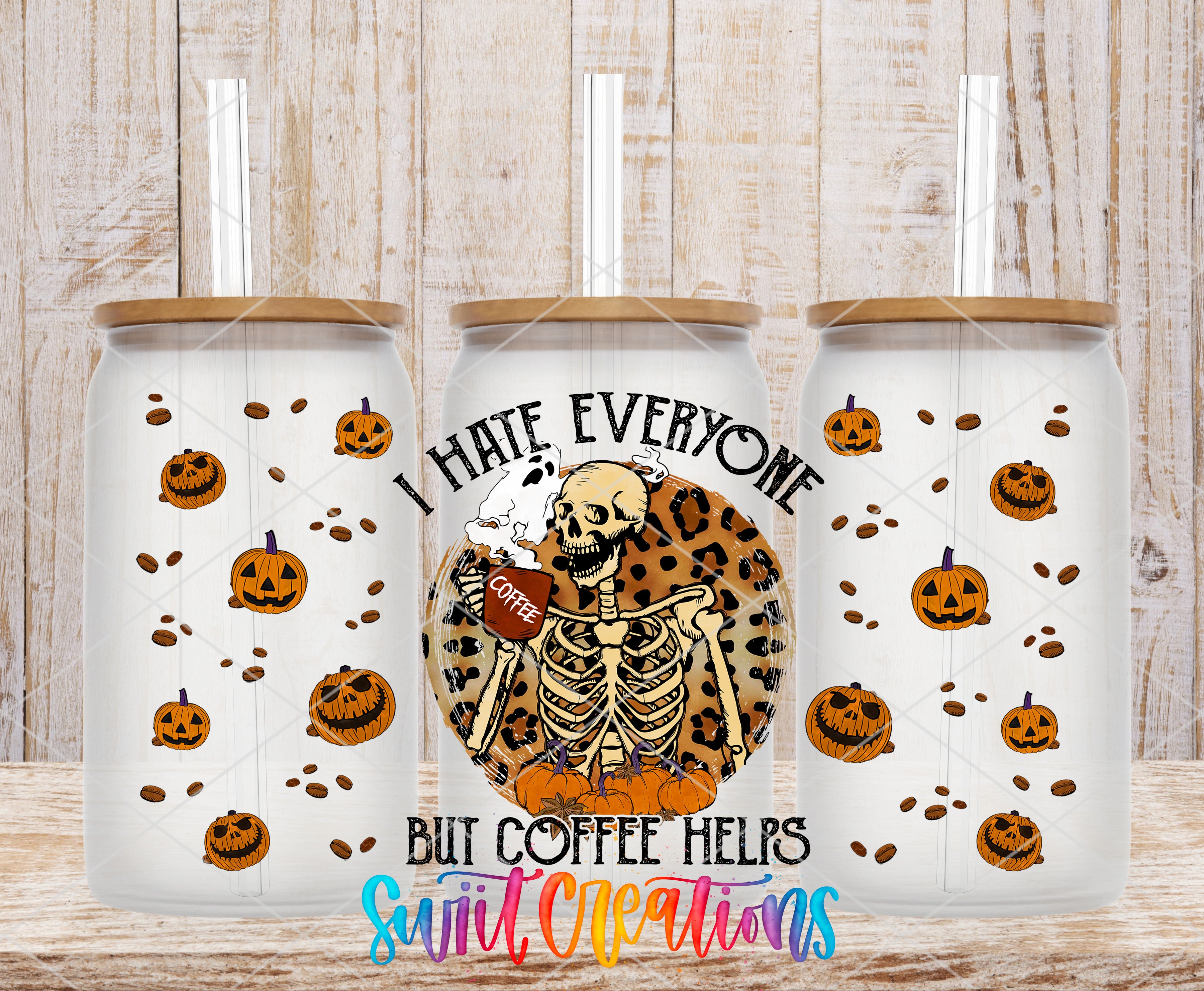 three white tumblers with a skeleton design and pumpkin motifs. The tumblers have a text that reads "I hate everyone but coffee helps" and a coffee cup graphic.
