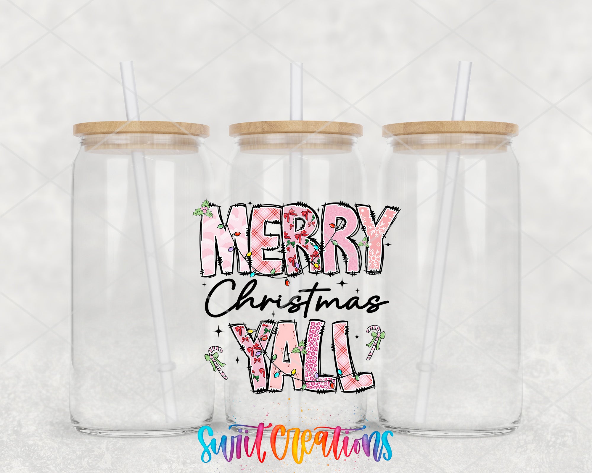 two clear tumblers with merry christmas wall written on them