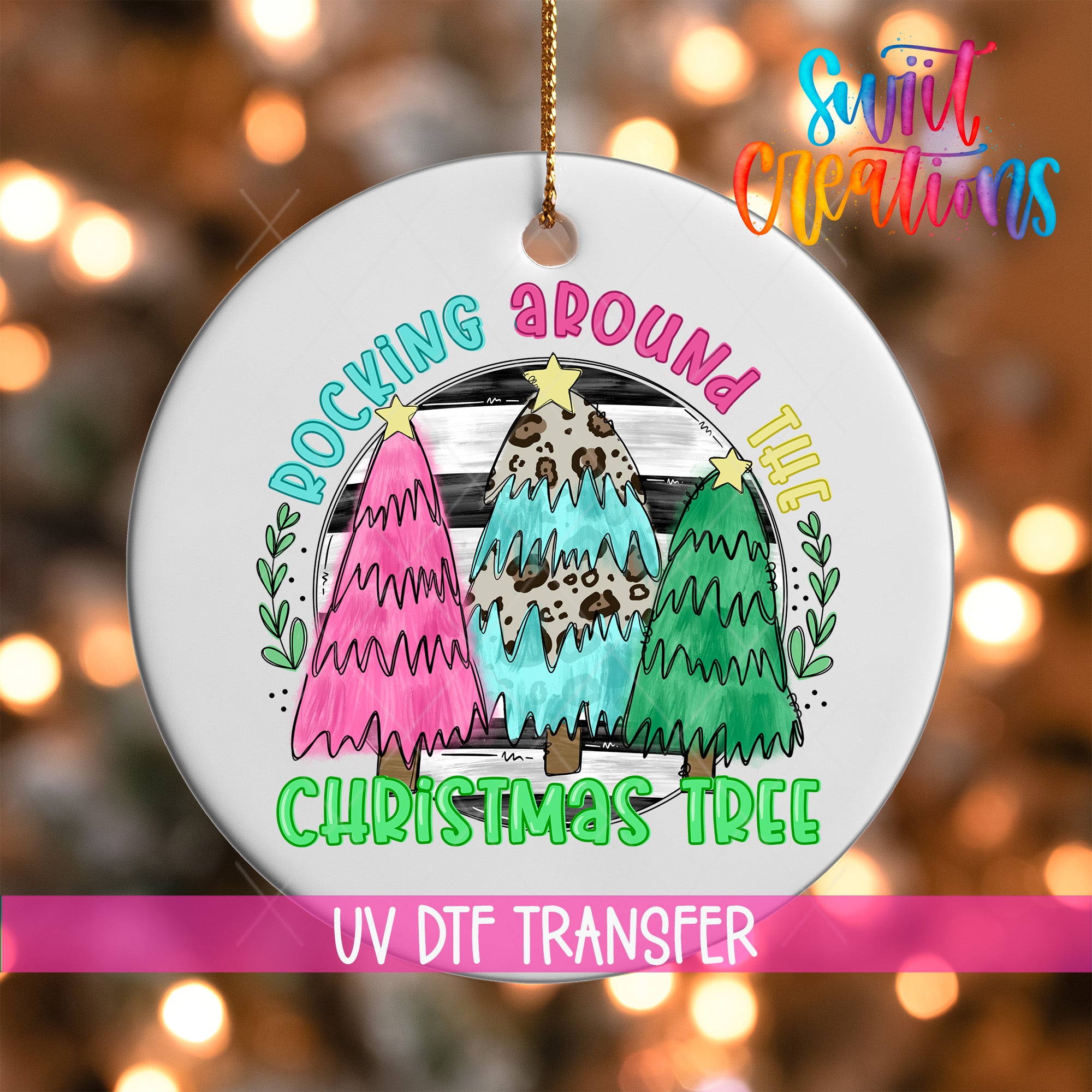 A white ornament with a colorful illustration of three Christmas trees, along with the text "Rocking around the Christmas Tree" and "UV Dtf Transfer".
