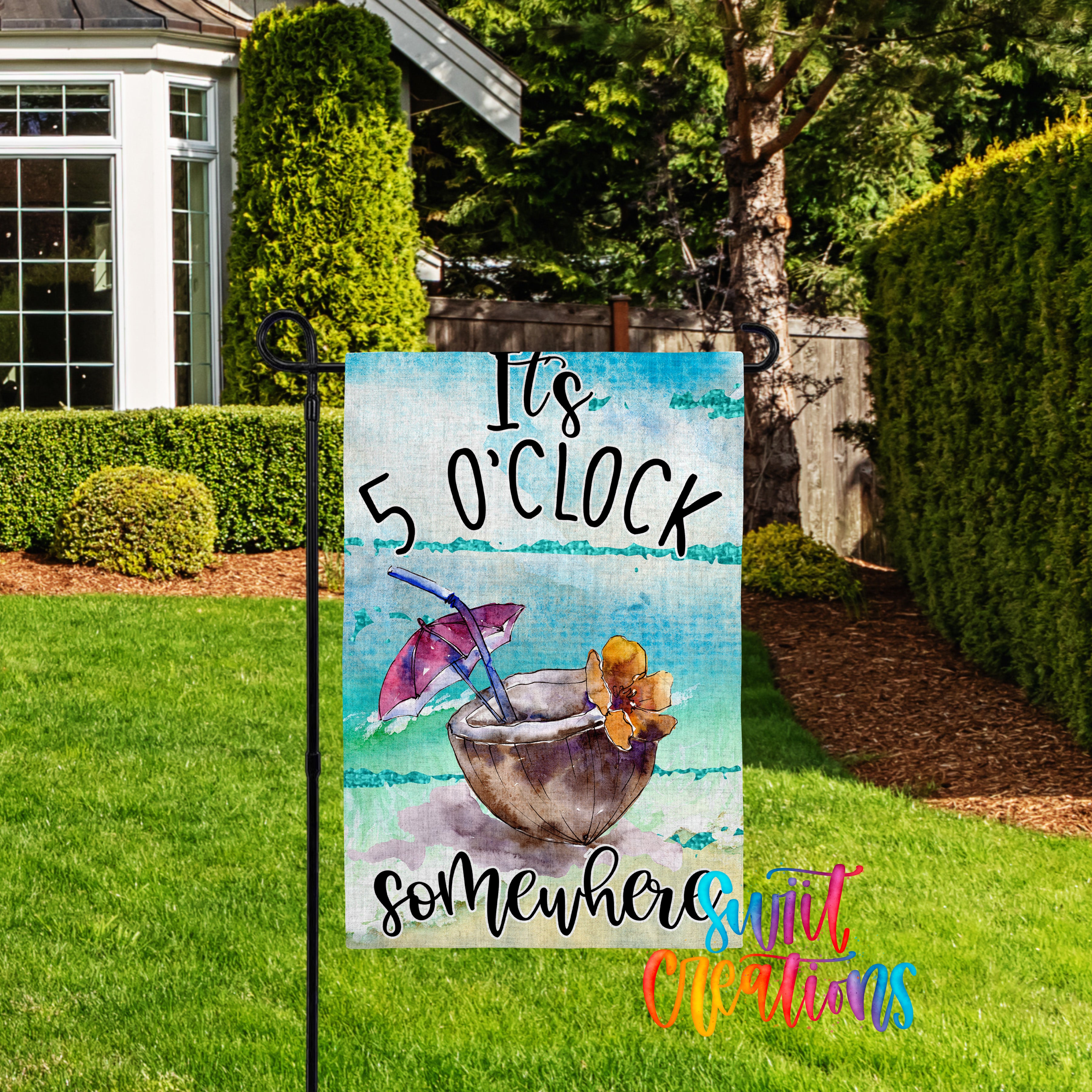 A colorful garden sign with the text "It's 5 o'clock somewhere" and an illustration of a cocktail glass with a flower.
